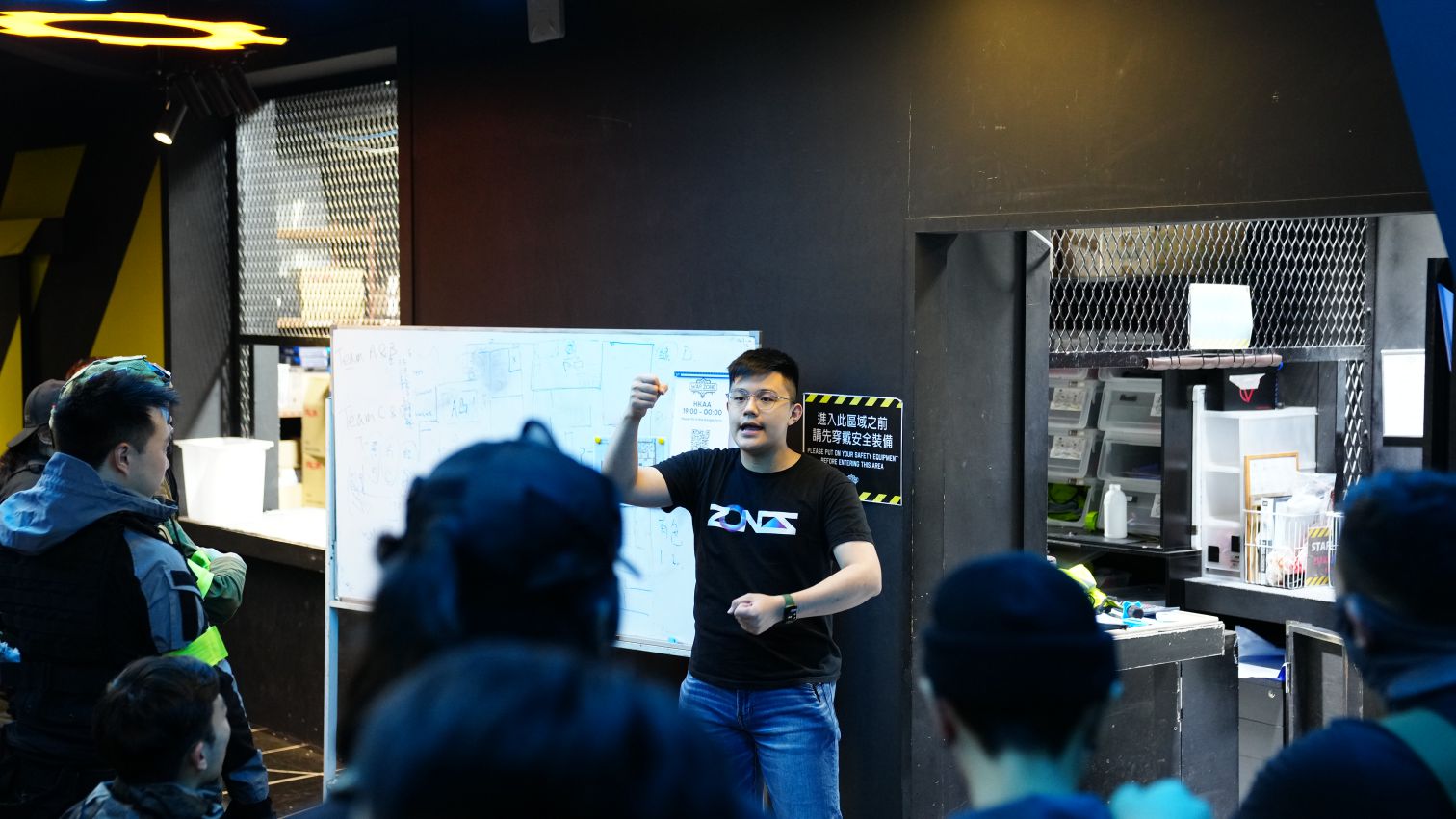 Zones staff giving a briefing to the team