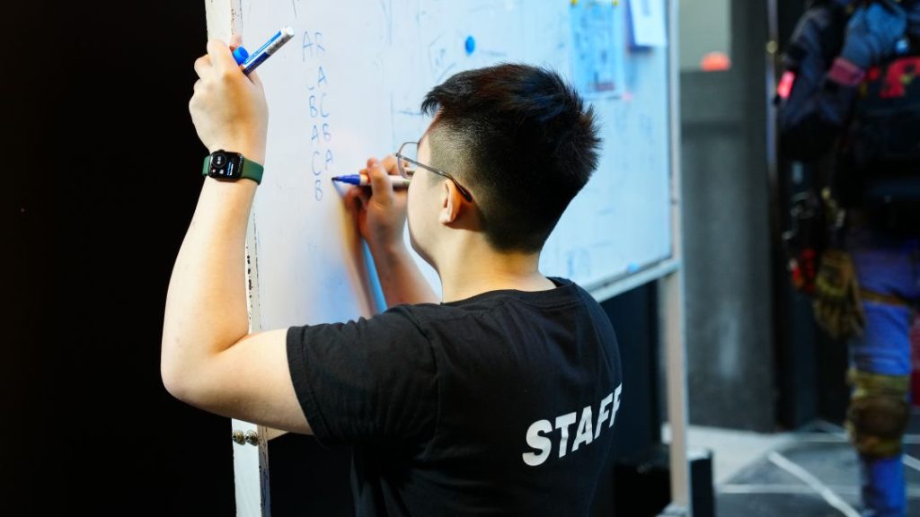 Zones Staff writing on Whiteboard